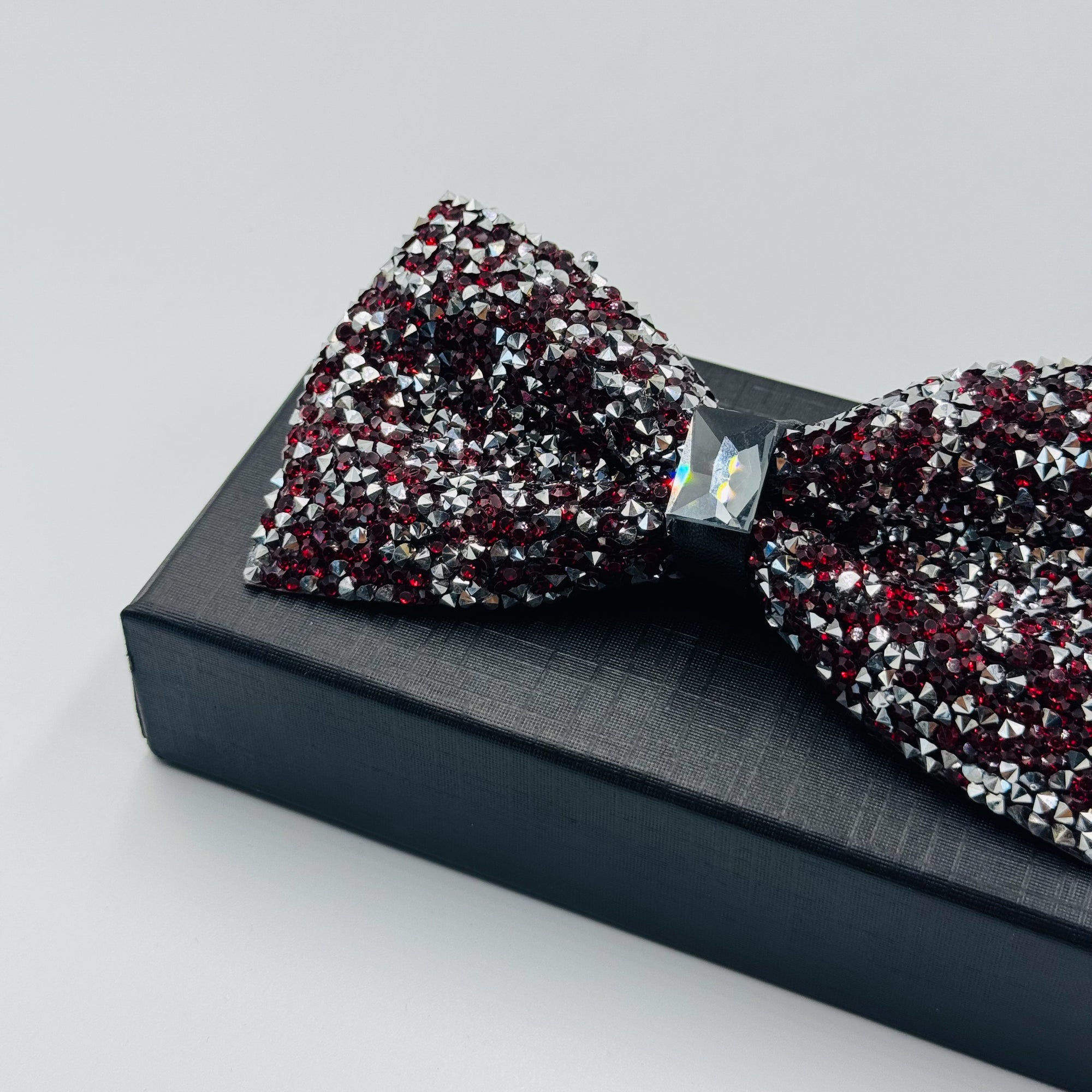 Bold & Stylish: Black, Red, and Silver Stone Bow Tie