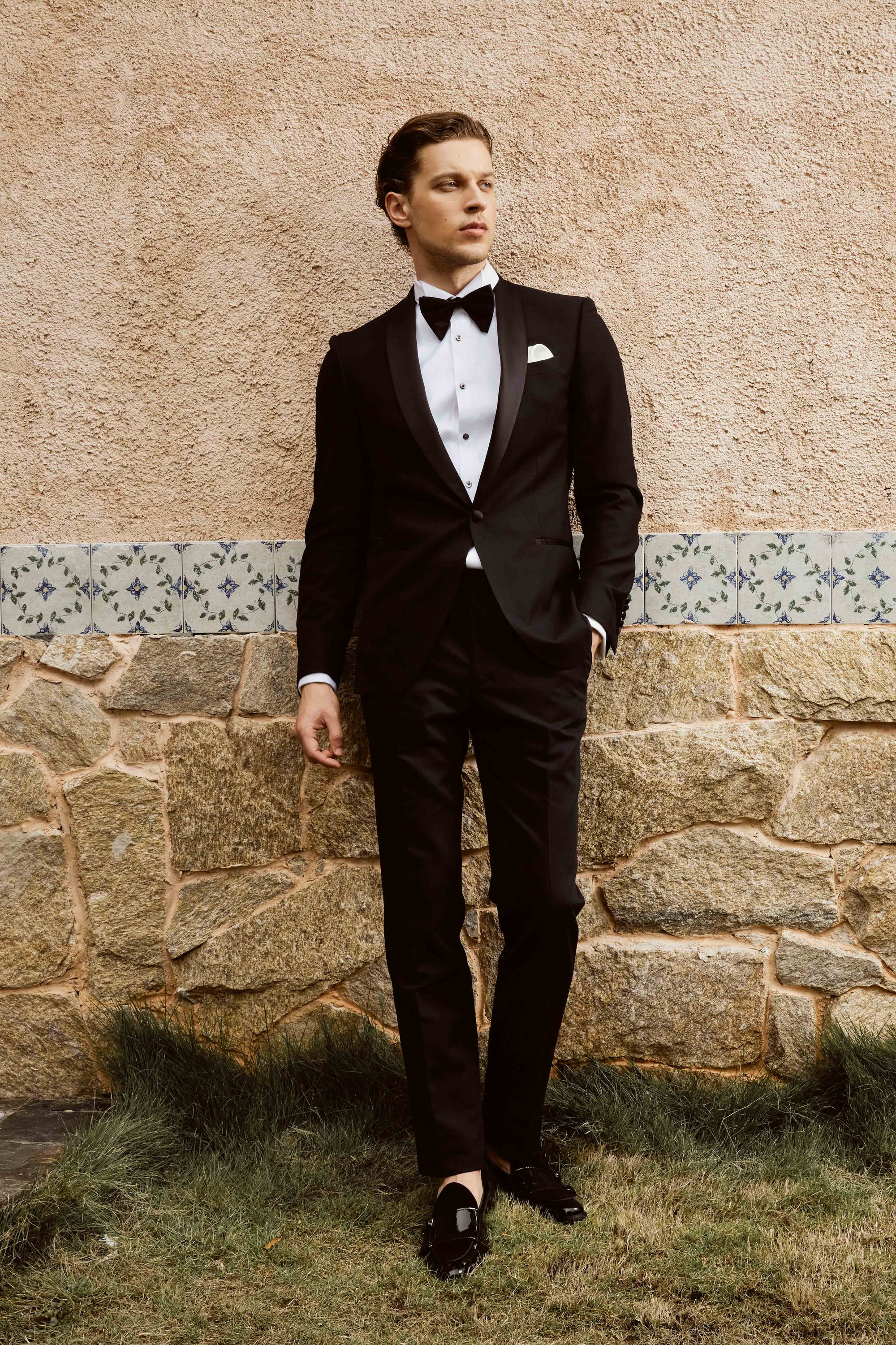 Black suit set with textured print and customized bow