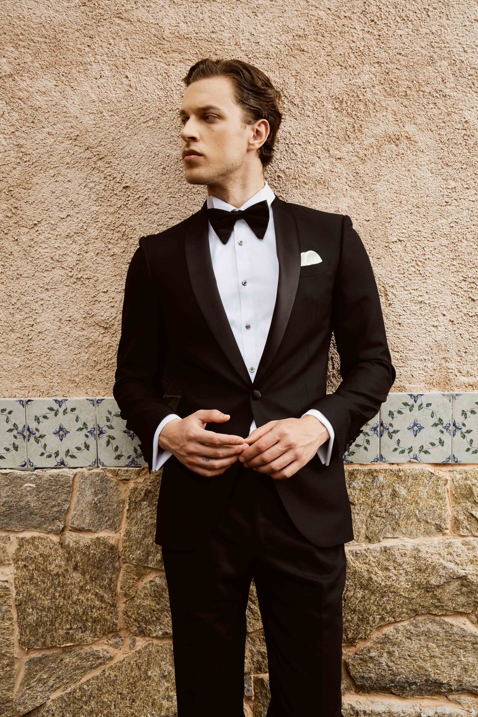 Black suit set with textured print and customized bow