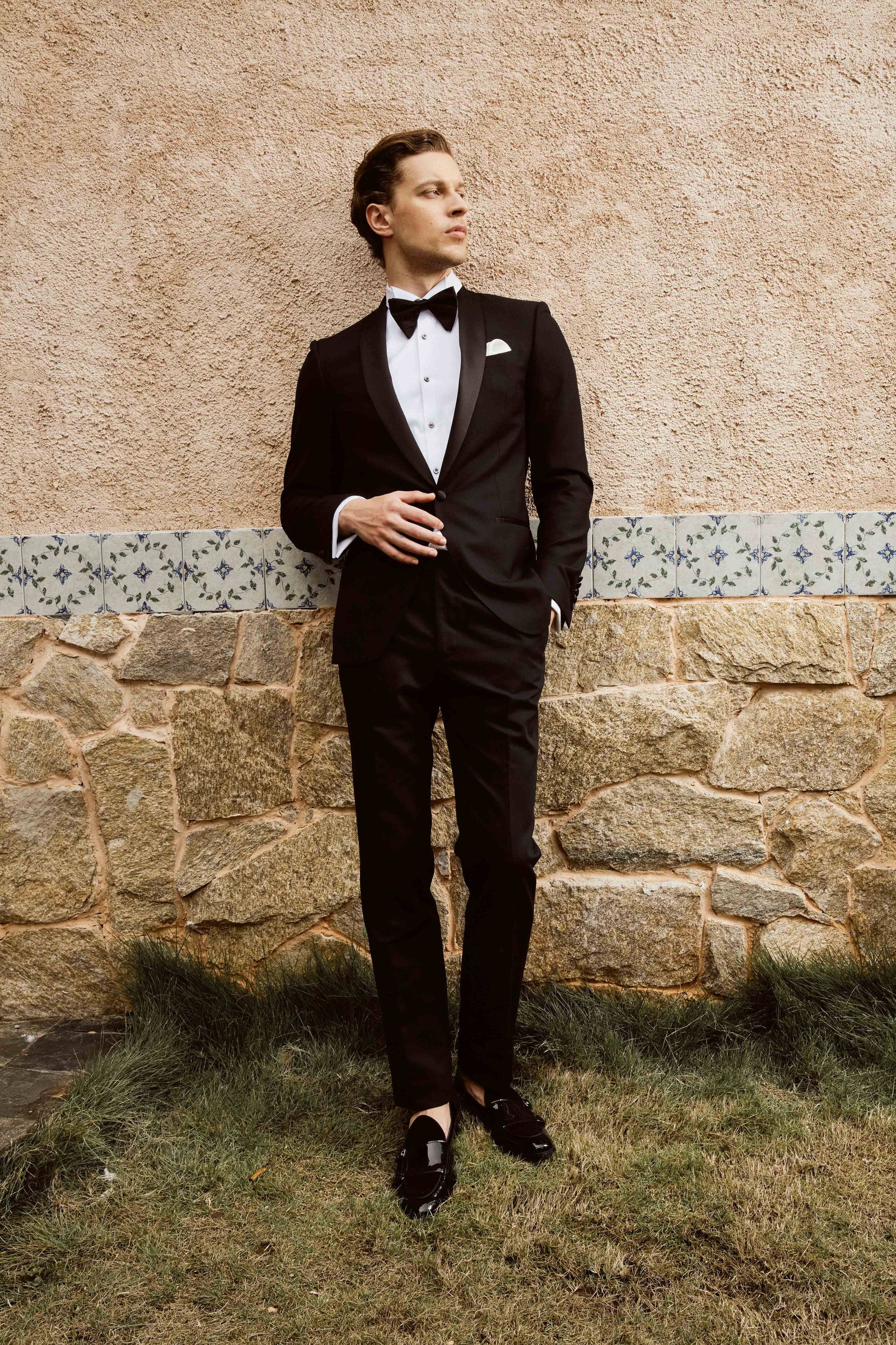 Black suit set with textured print and customized bow