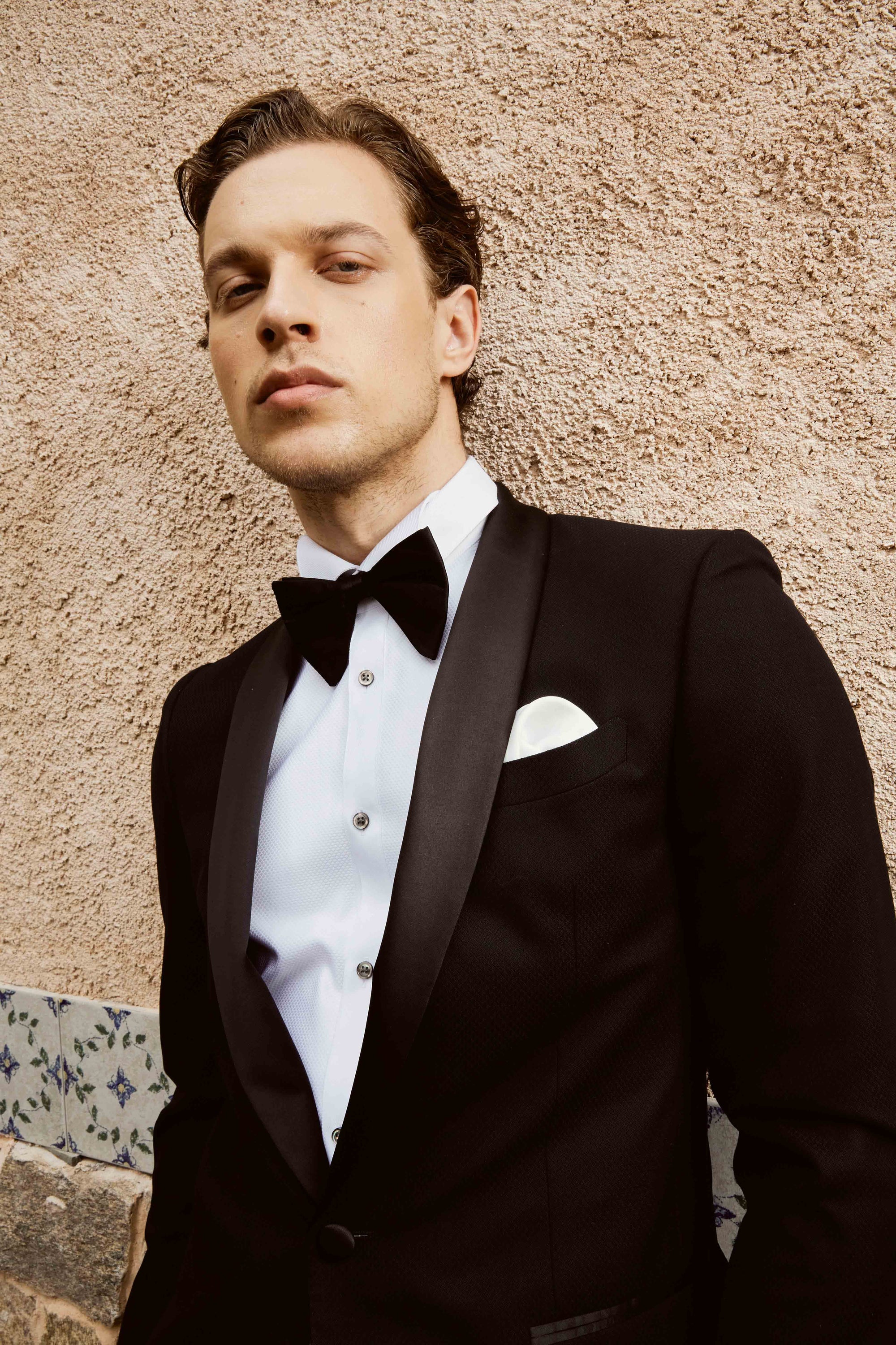 Black suit set with textured print and customized bow